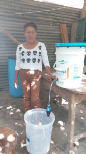 Peru photo good! - women with 2nd bucket clean water filtering 4432-A.H LAS BRISAS-Rosa Curinuqui Tapayuri