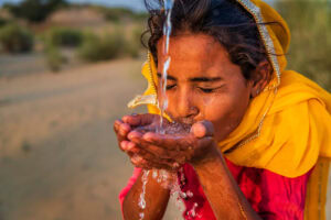 Pakistan young girl drinking fresh water
