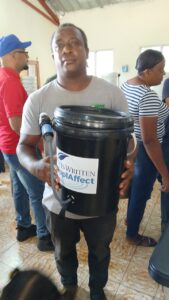 Dominican Republic 2025 - Man with bucket and signige - IIW - 18759-Jose Luis Contreras Castro