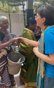 India 2026 shaking hand with elderly women
