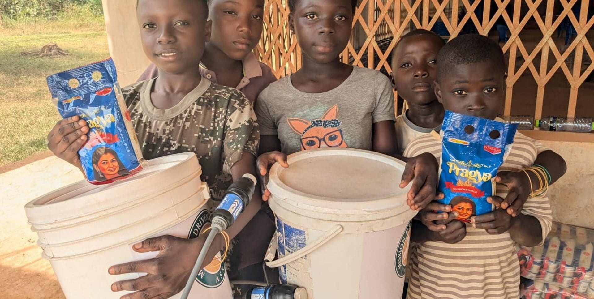 Ghana 2026 - kids with buckets - Slider