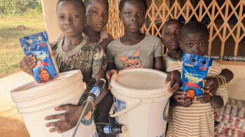 Ghana 2026 - kids with buckets - Slider