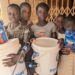 Ghana 2026 - kids with buckets - Slider