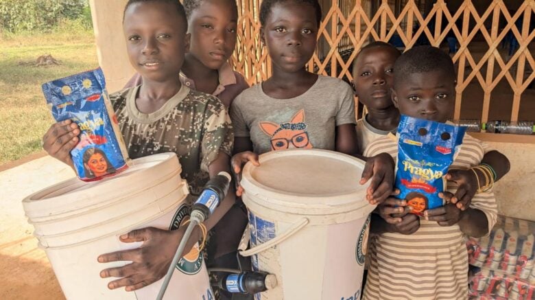 Ghana 2026 - kids with buckets - Slider