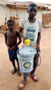 Ghana - two boys and bucket