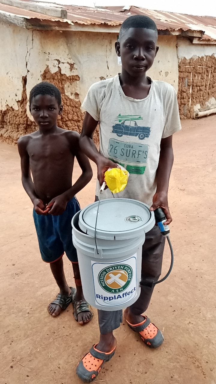 Ghana - two boys and bucket